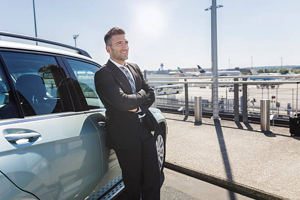 Driver meeting passenger at Sydney Airport priority pickup area